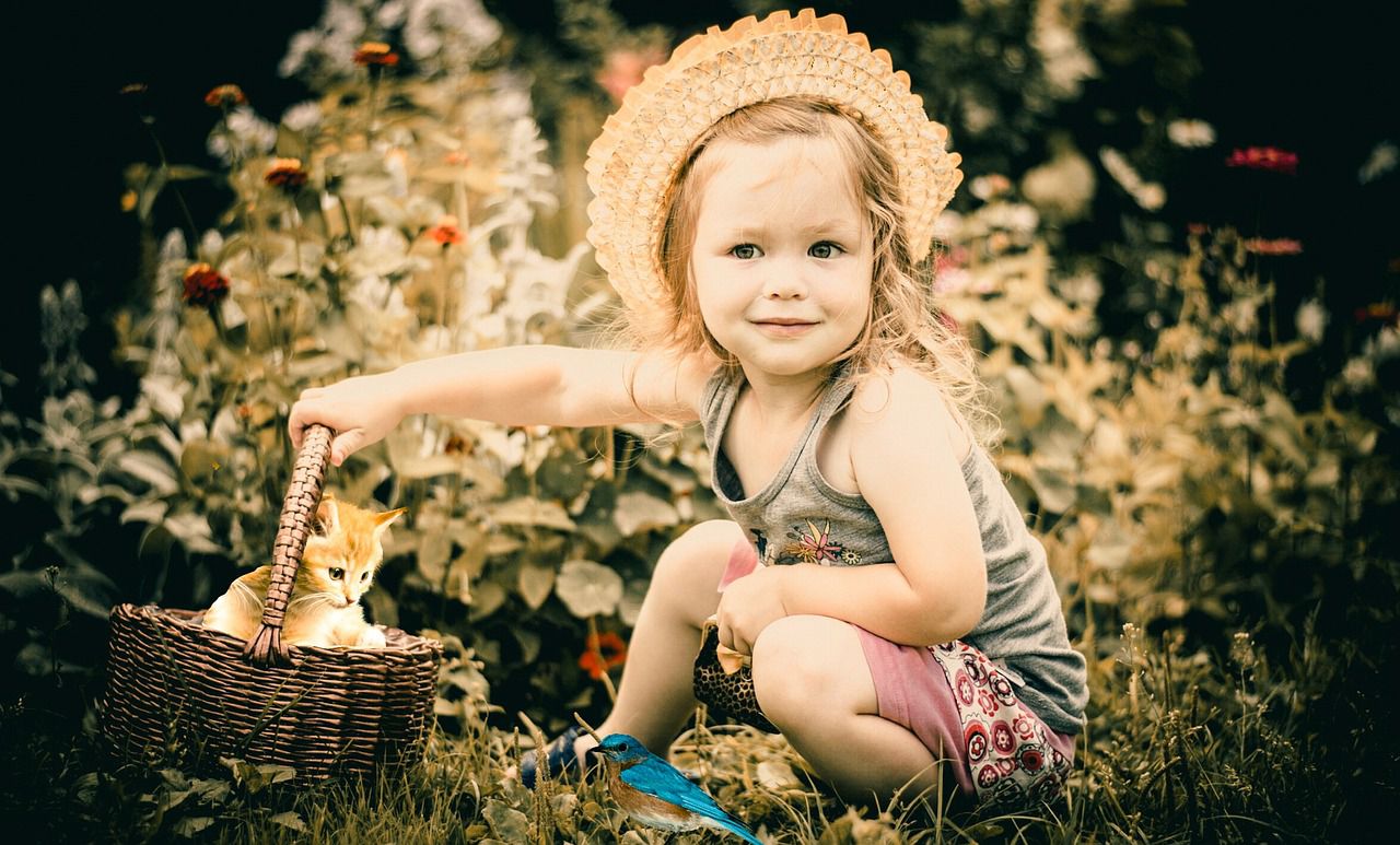 child with a pet