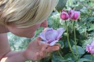 woman smelling flowers